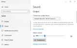 The Windows 10 Sound Settings dialog showing the Choose Your Output Device list.