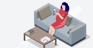 A person sitting on a couch. They are using a mobile device to attend an appointment.